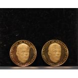 Set of two gold coins commemorating John F. Kennedy (1917-1963).