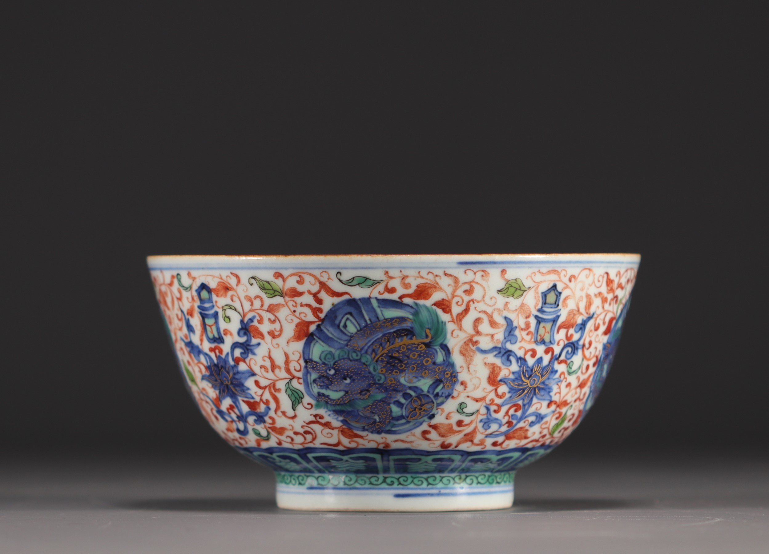 China - Large porcelain bowl decorated with lions in cartouche and flowers, Ming mark.