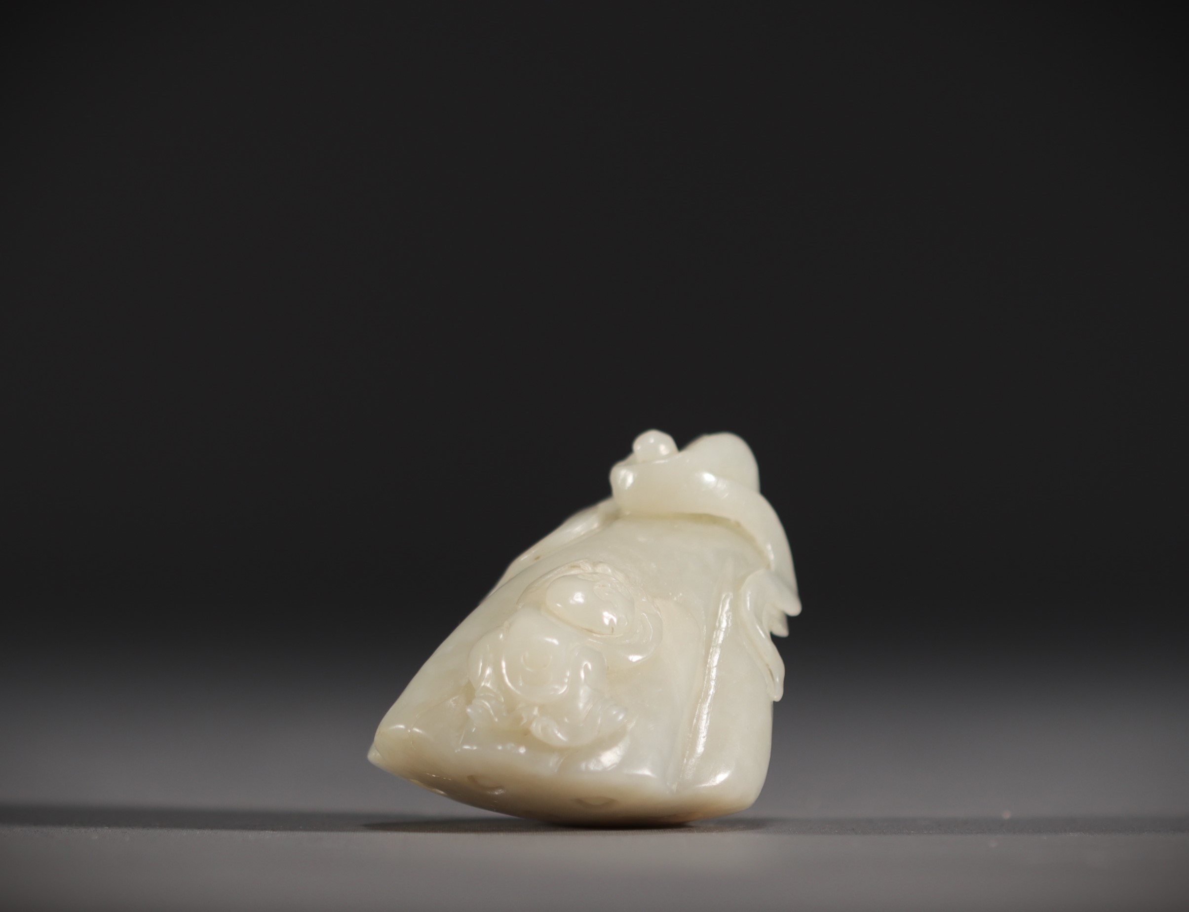 China - White jade pendant in the shape of a fruit surmounted by a young child. - Image 2 of 6