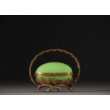A Napoleon III period egg-shaped jewellery box in green opaline with brass mount.