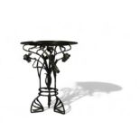 Glass table with floral wrought iron base, Art Nouveau period.