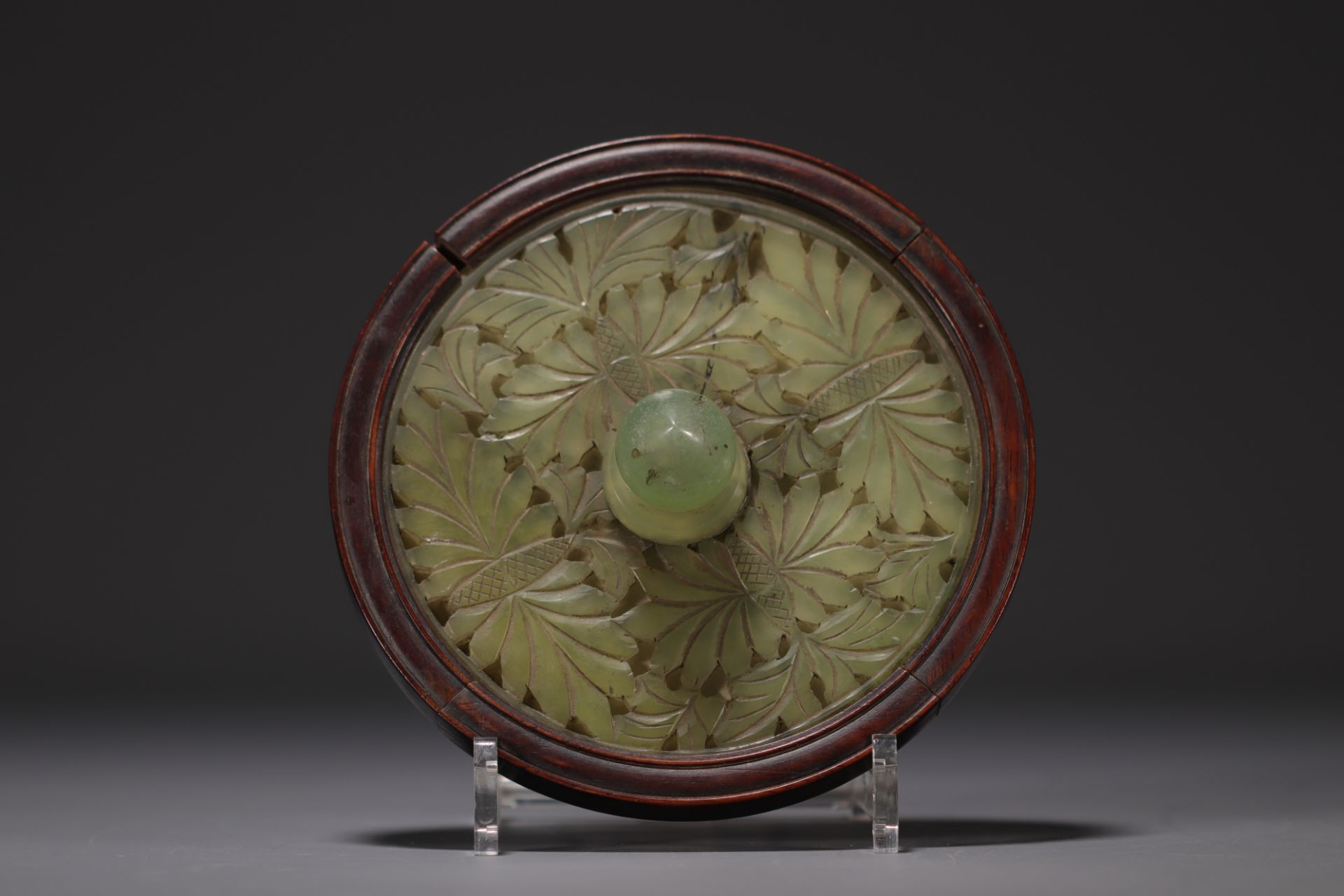 China - Carved jade hand mirror.