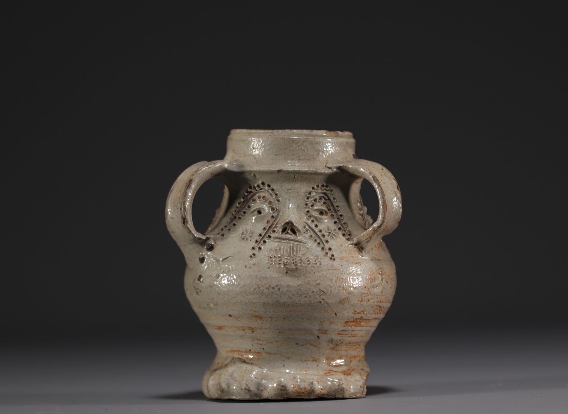 Raeren - Rare stoneware jug decorated with faces, salt glaze, early 16th century.