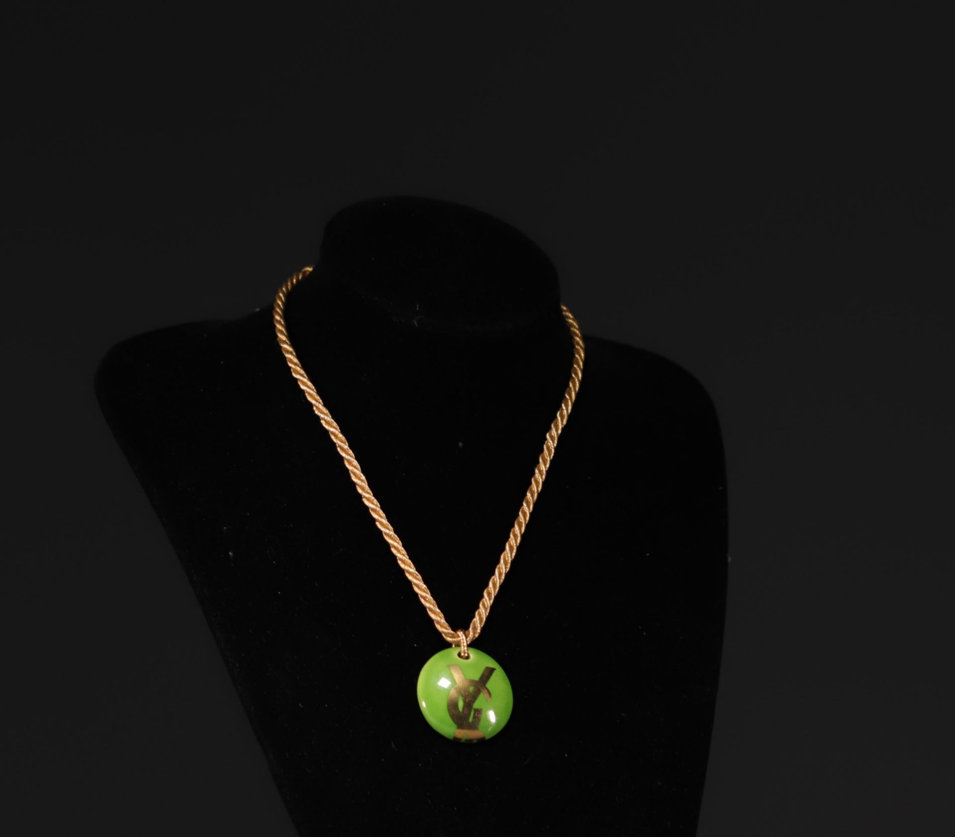 Yves SAINT LAURENT - Green and gold porcelain pendant, monogrammed YSL.