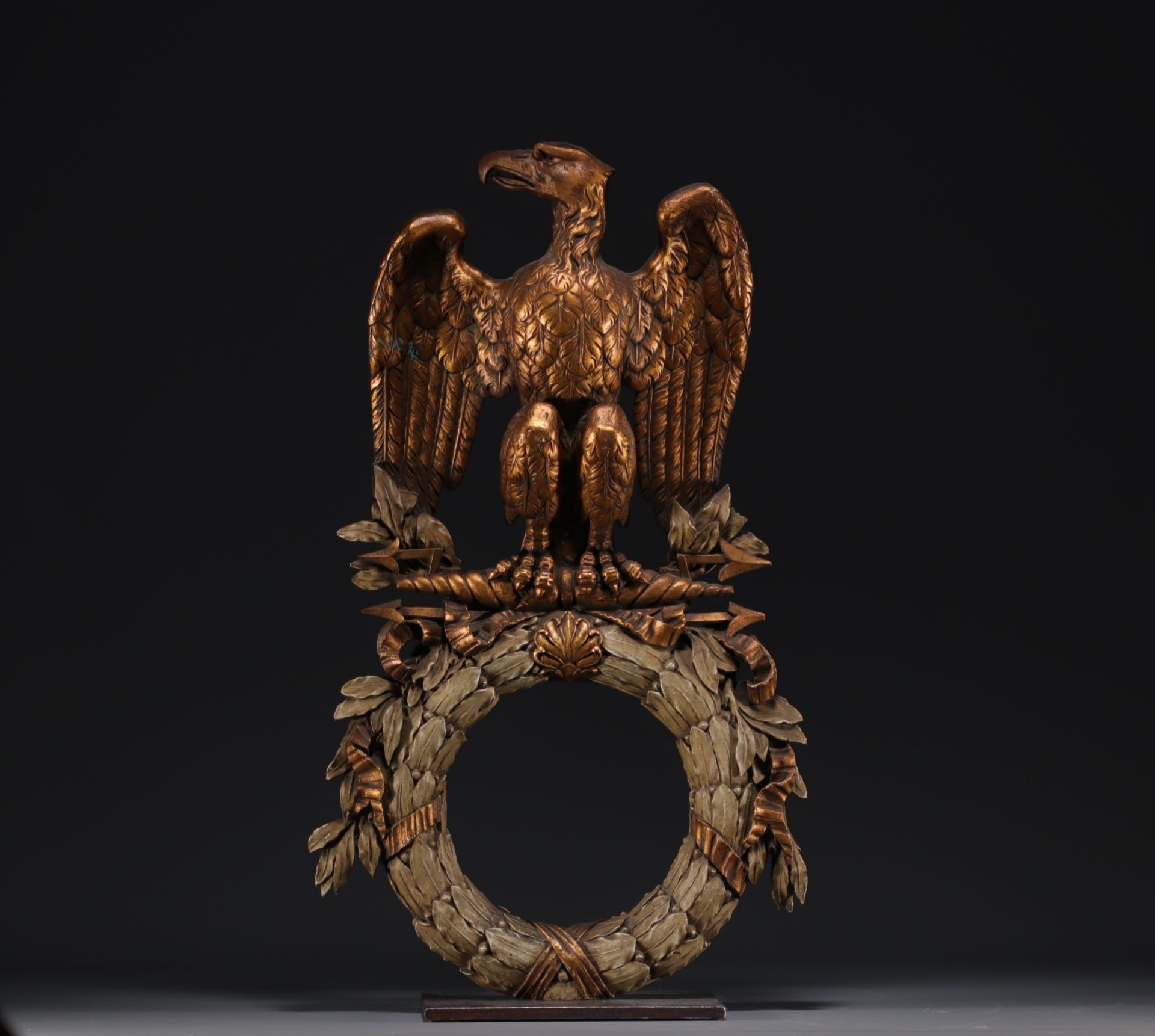 An Empire period carved and gilded Imperial eagle with outstretched wings.