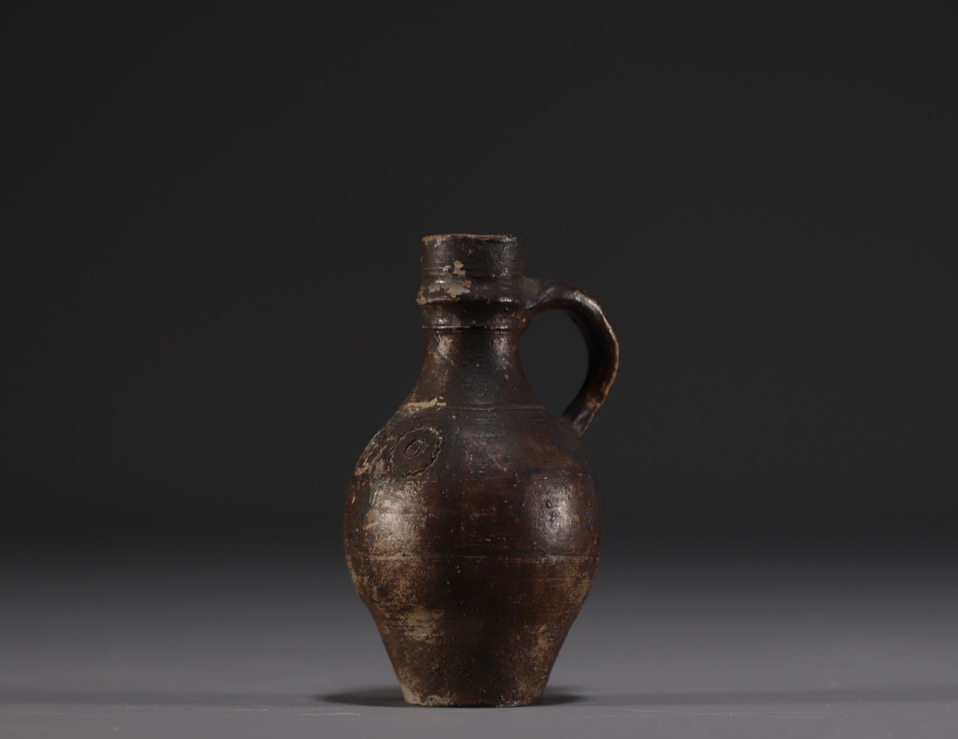 Raeren - Stoneware miniature jug with face decoration, 16th century. - Image 4 of 5