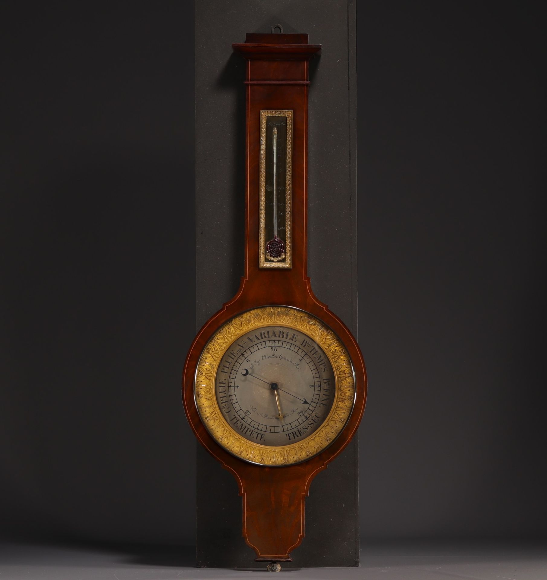 Barometer in mahogany veneer and gilt bronze "Chevallier opticien du Roi", 19th century.