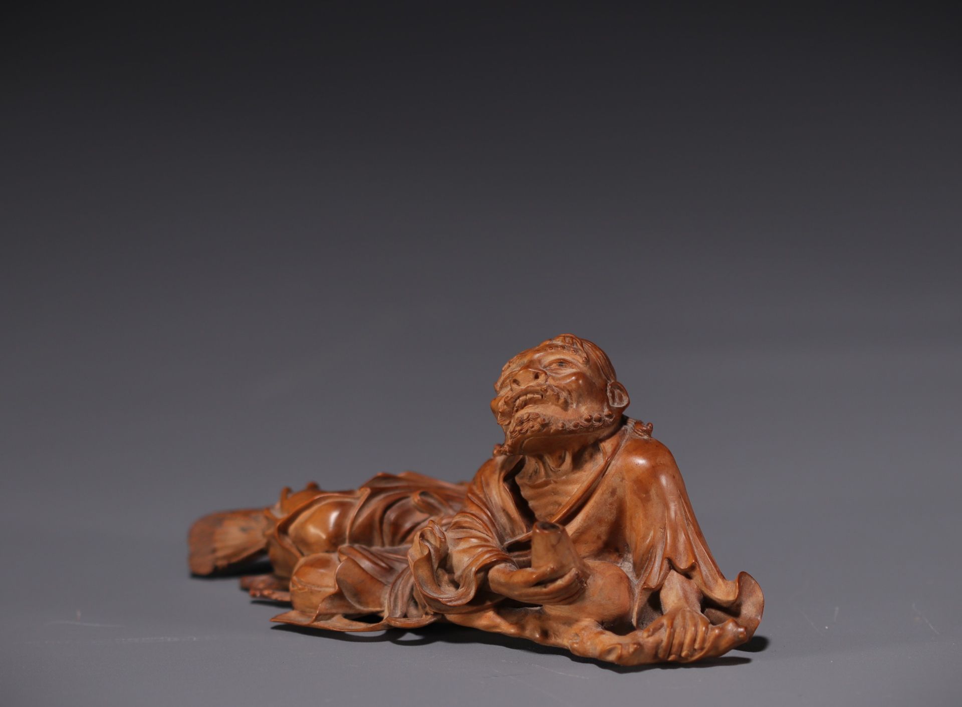 Japan - Boxwood sculpture of a reclining old man, late 19th century. - Image 3 of 3