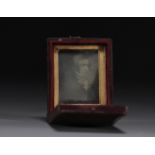 Old small souvenir box containing a mirror with a picture of a gentleman. 19th century.