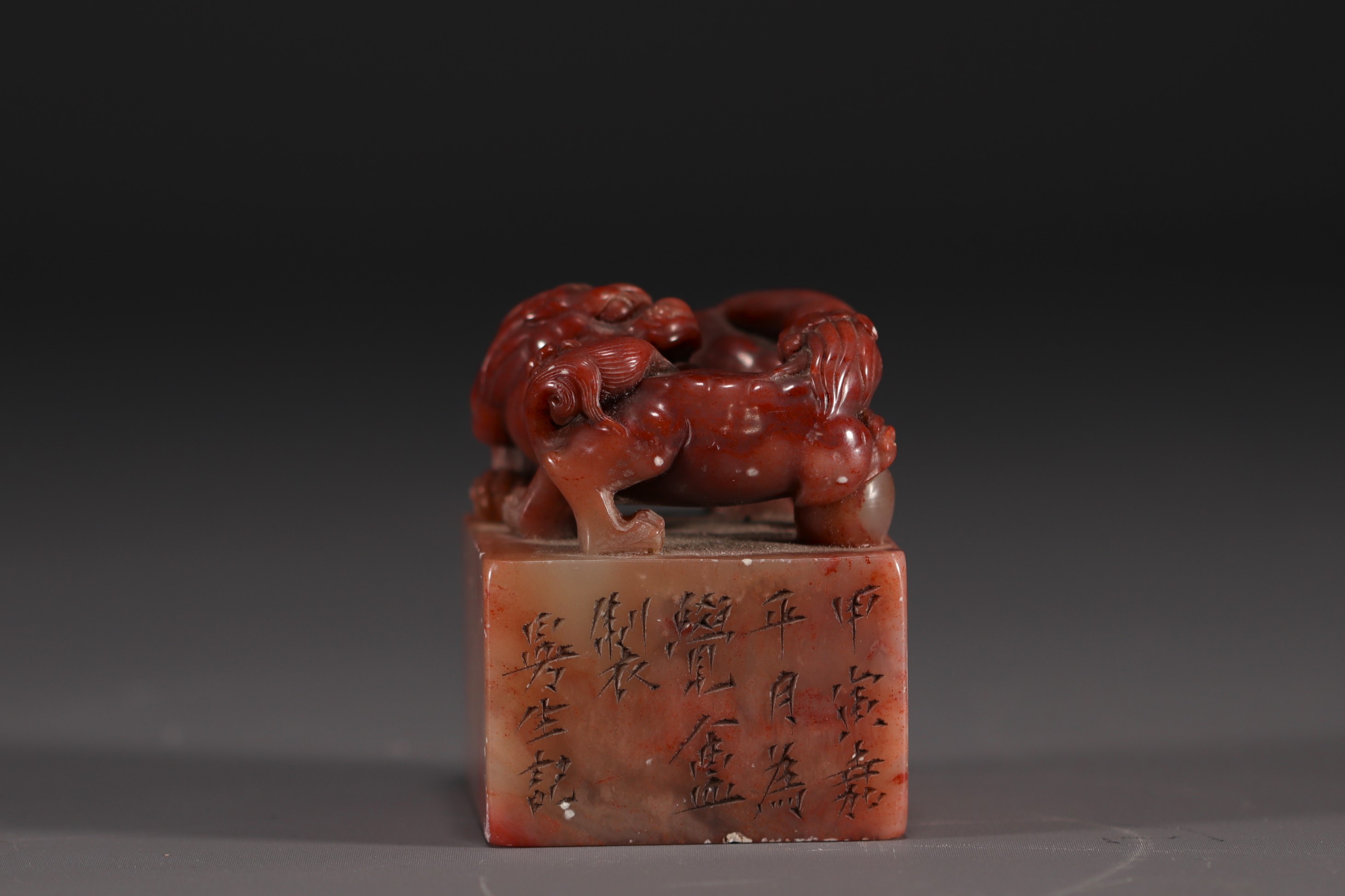 China - Carved stone seal surmounted by two lions, calligraphy, Qing period.