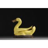 China - Yellow porcelain duck on wooden base, Qing period.