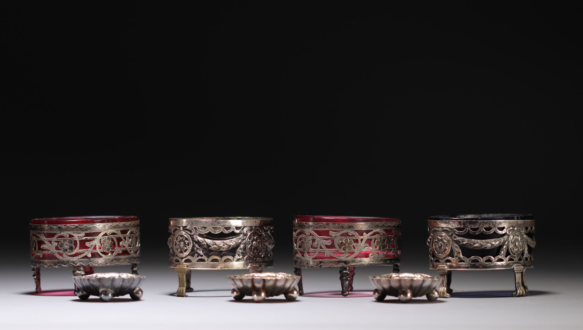 Set of four silver and three silver-plated metal salad bowls. 19th and 20th century.