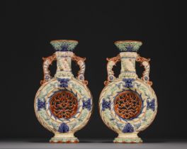 Pair of Wasmuel earthenware openwork "Buire" vases, circa 1900.