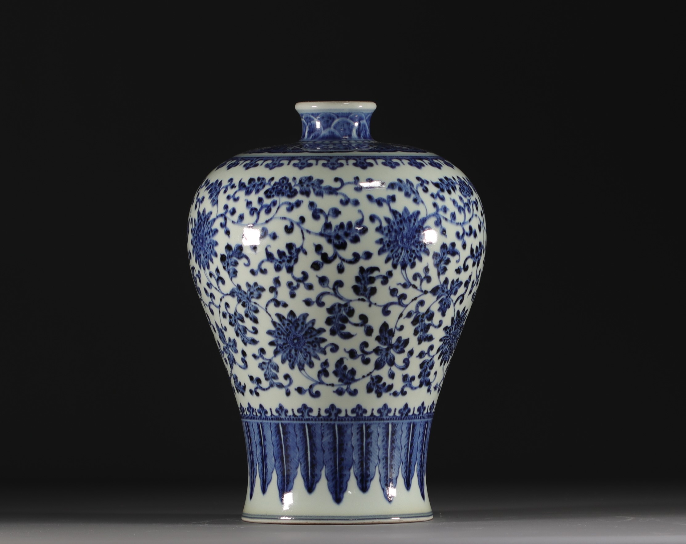 China - A blue and white Meiping vase with floral and banana leaf decoration, Qing period.