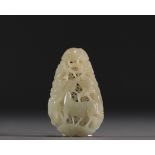China - Carved and openworked white jade pendant with animal decoration, 18th century.
