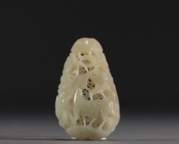 China - Carved and openworked white jade pendant with animal decoration, 18th century.