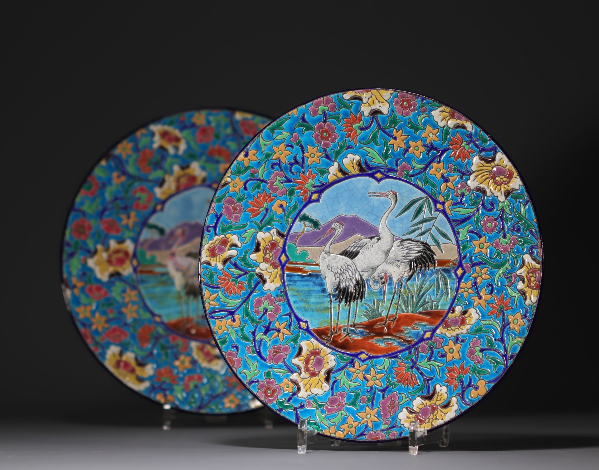 Longwy - Pair of large enameled plates decorated with cranes. - Image 3 of 3