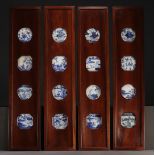 China - Suite of four panels decorated with sixteen blue-white porcelains, Ming and Kangxi period, 1