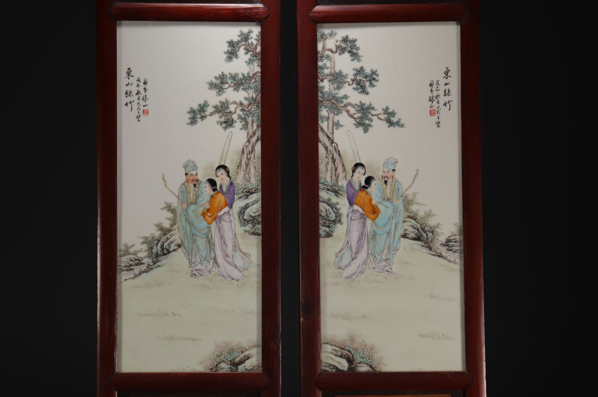 China - Pair of porcelain and wood panels decorated with characters. - Image 2 of 2