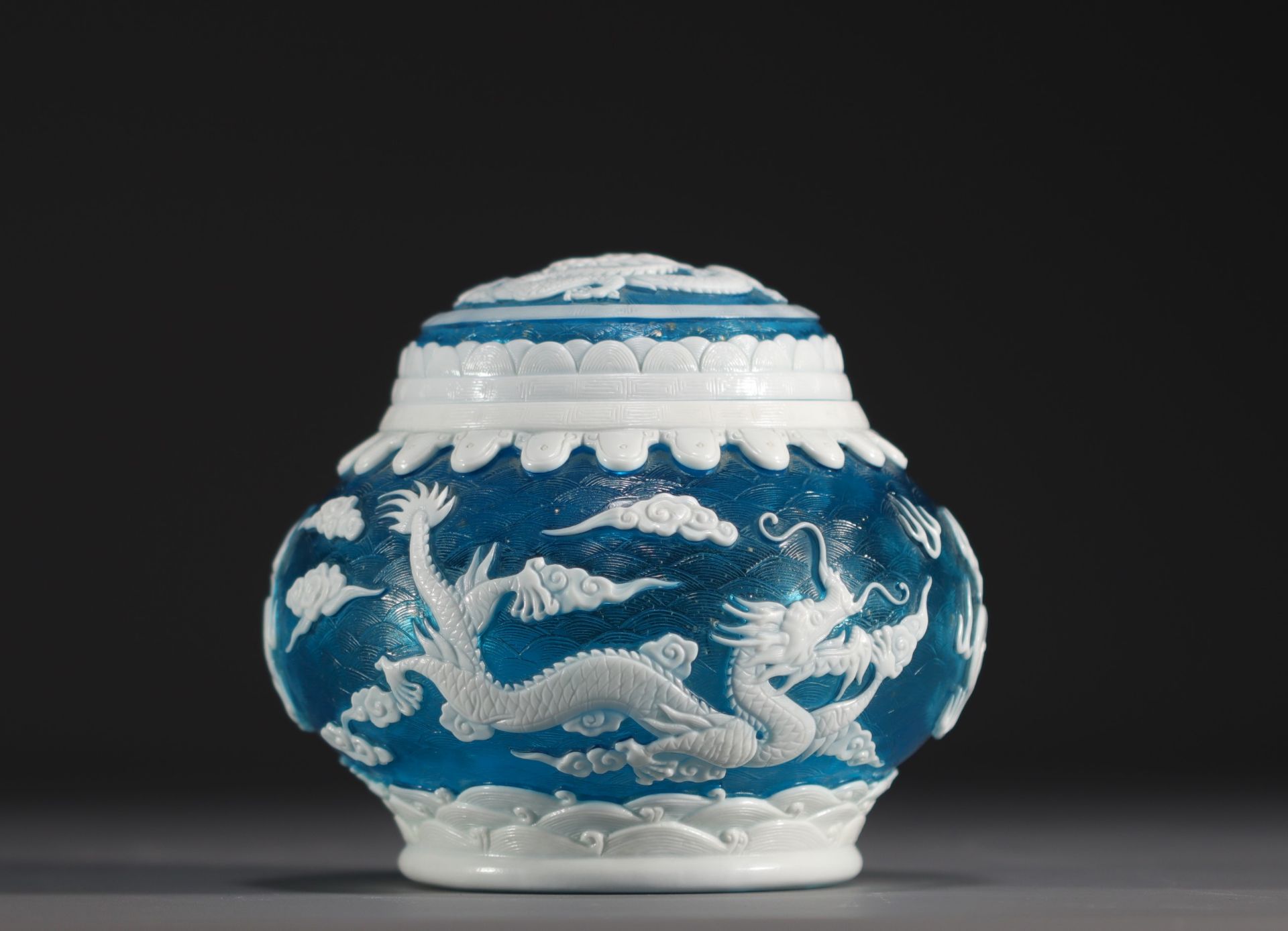China - Peking glassware covered pot decorated with dragons and gold flakes.