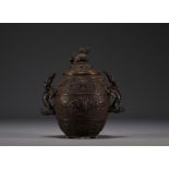 China - Bronze perfume burner decorated with dragons, lid surmounted by a Fo dog.