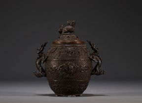 China - Bronze perfume burner decorated with dragons, lid surmounted by a Fo dog.