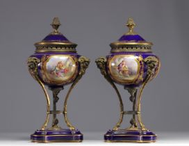 Pair of Sevres porcelain cassolettes decorated with gallant scenes, mounted on bronze.