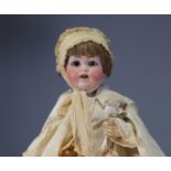 J.D. KESTNER - Bisque character baby head nÂ° 257, open mouth in christening gown, circa 1910.