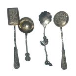 Asia - Set of four silver spoons decorated with bamboo and flowers.