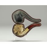 Meerschaum pipe carved with a woman's head, in its scabbard, 19th-20th century.