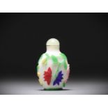 China - Snuffbox in multi-layered glass with floral decoration on a white background