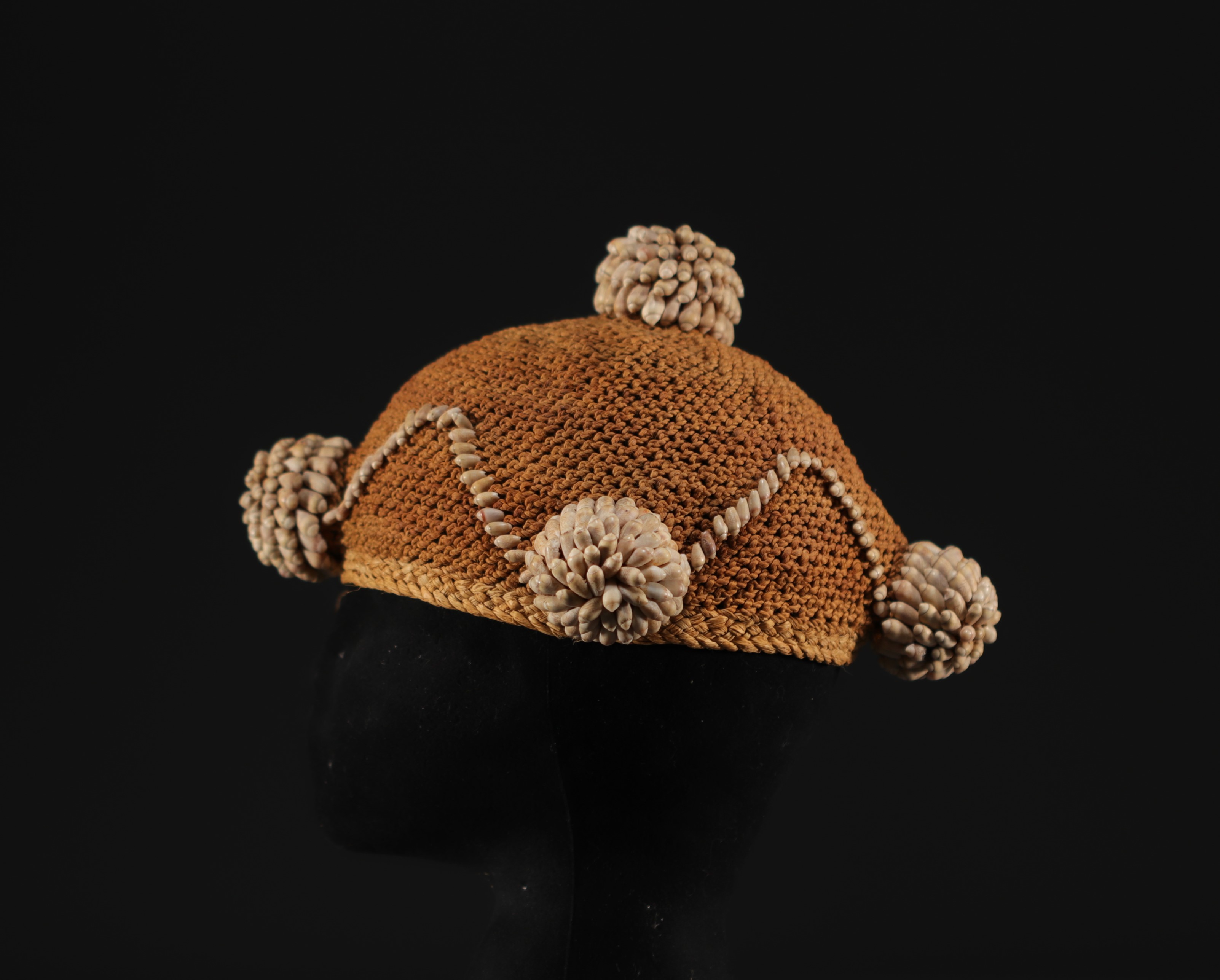 African headdress made of fibre and shells.