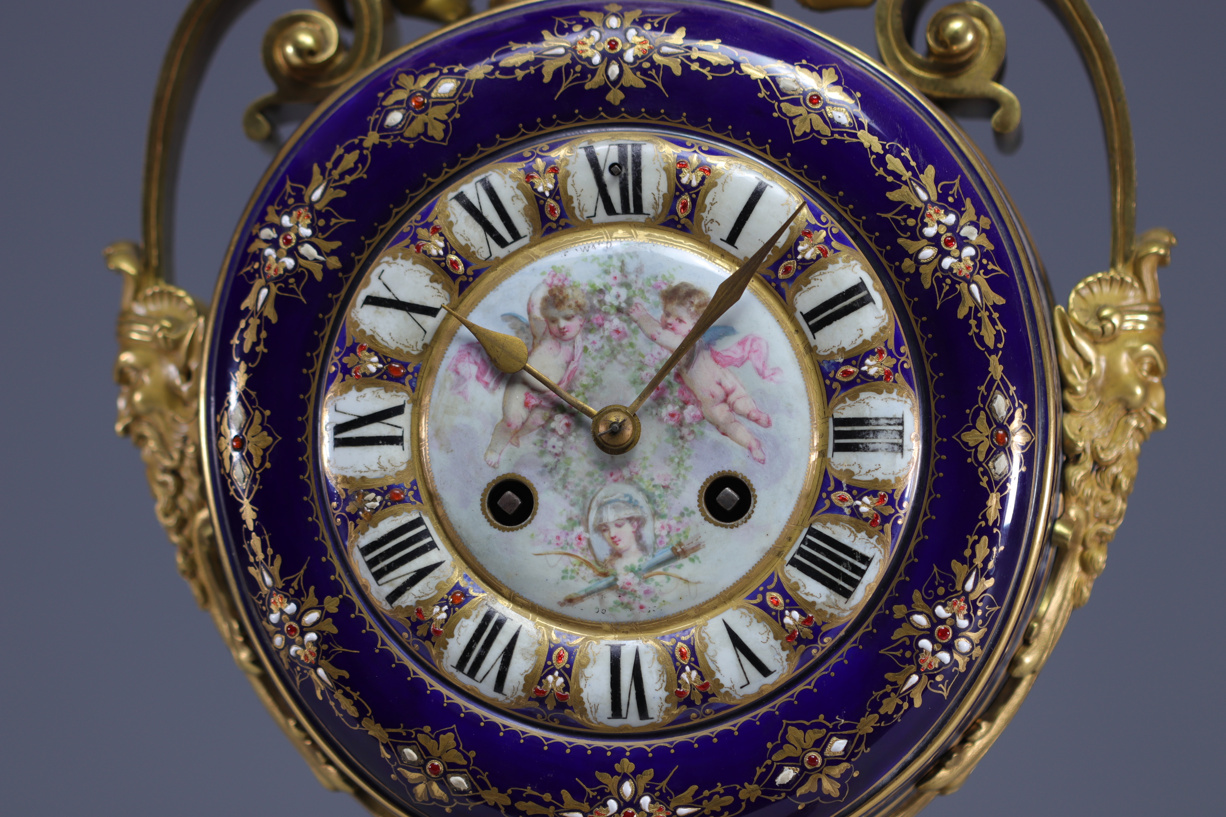 A rare Sevres porcelain and gilt bronze clock decorated with cherubs. - Image 6 of 8