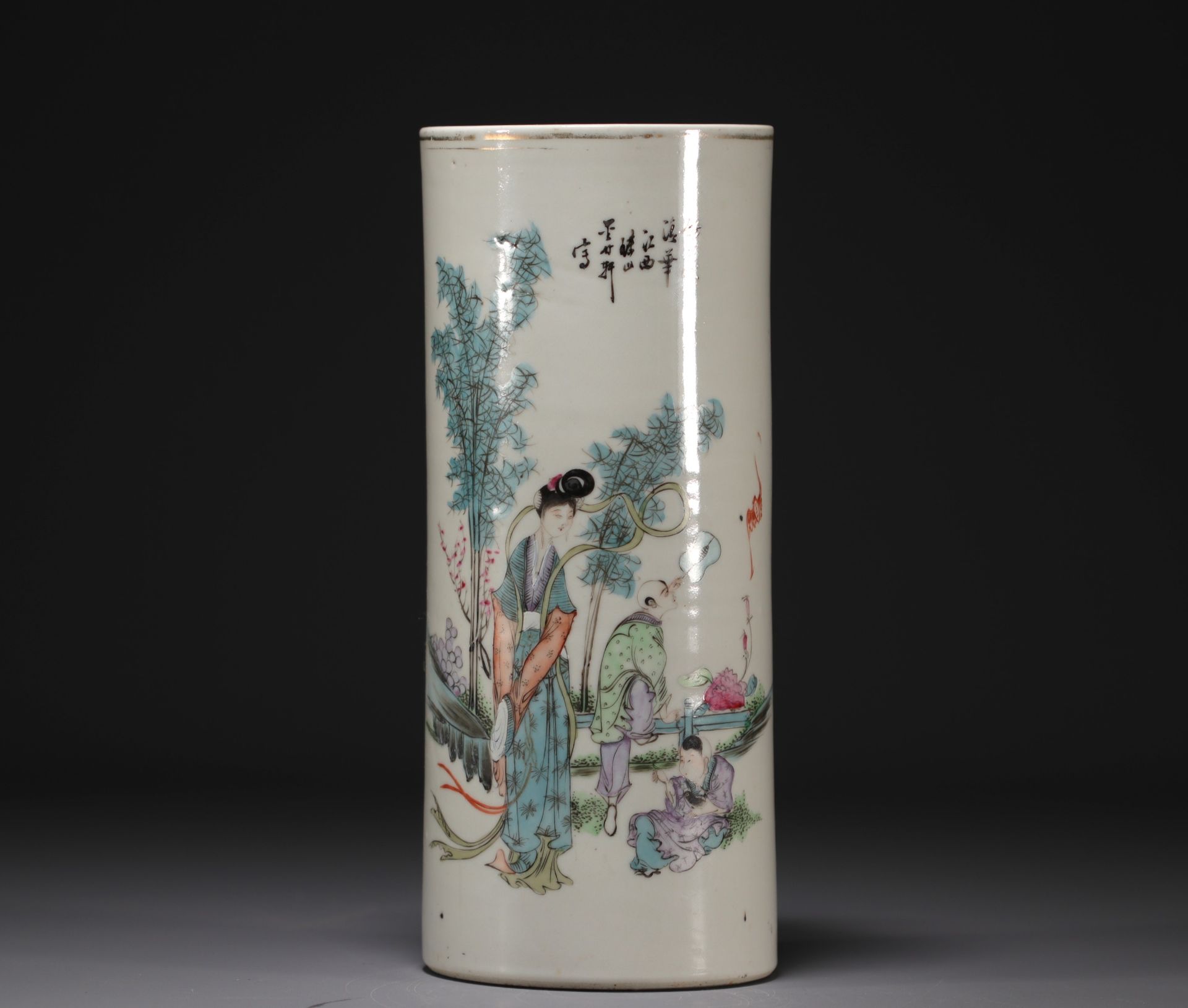 China - Famille rose porcelain brush-holder decorated with figures.