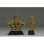 China - Set of two hard stone sculptures, one decorated with lions and a Sage, on wooden bases.