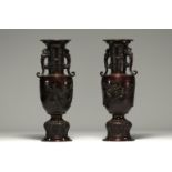 Japan - A pair of bronze vases with a brown patina, decorated with birds.