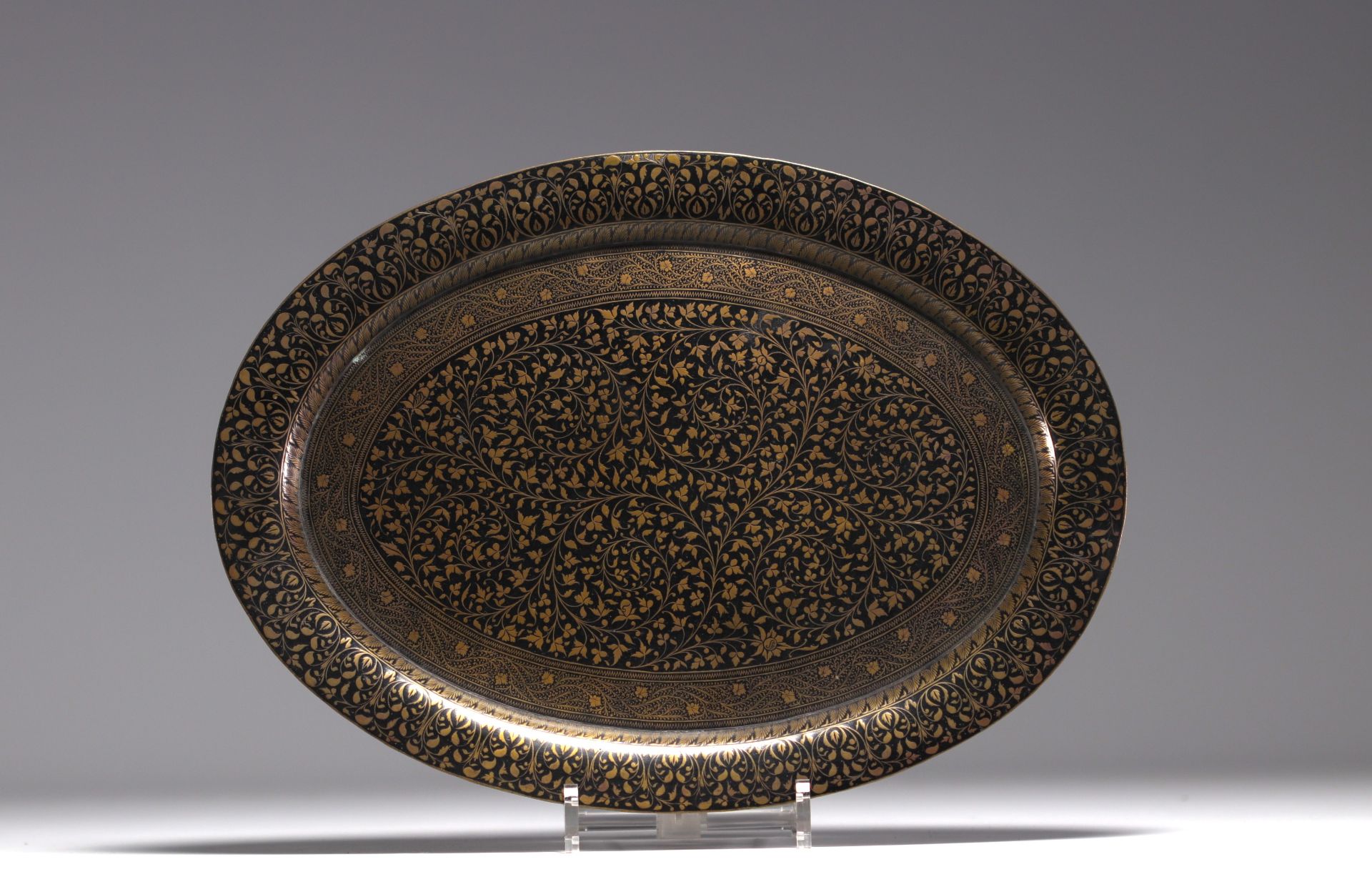 Iran - Copper and black lacquer tray with floral decoration, 19th-20th century