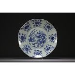 China - Large blue-white porcelain dish decorated with a five-clawed dragon and a phoenix.