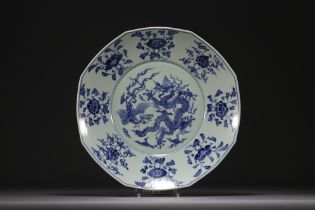 China - Large blue-white porcelain dish decorated with a five-clawed dragon and a phoenix.