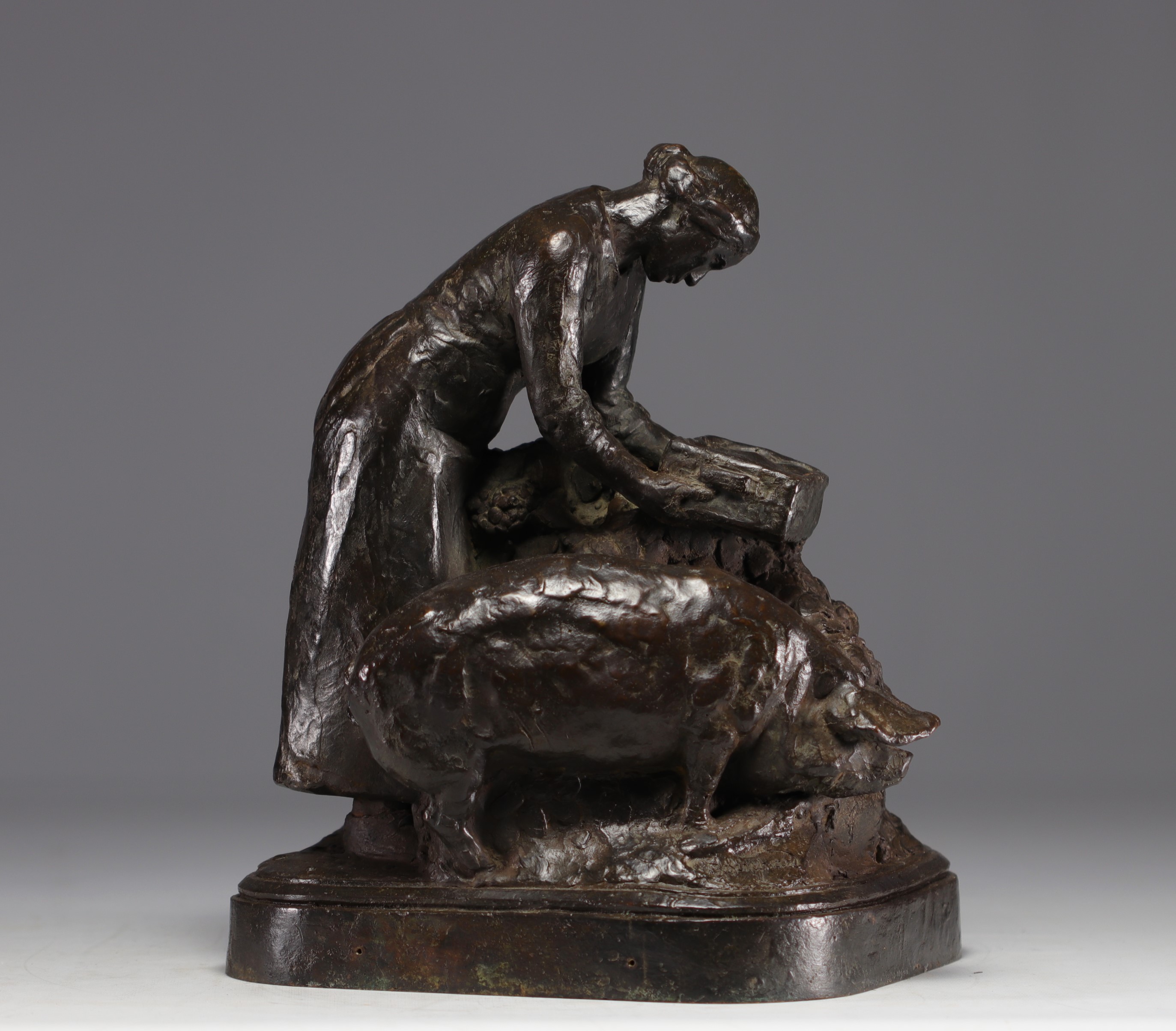 Henri Louis BOUCHARD (1875-1960) "The farmer feeding her pigs" Bronze sculpture