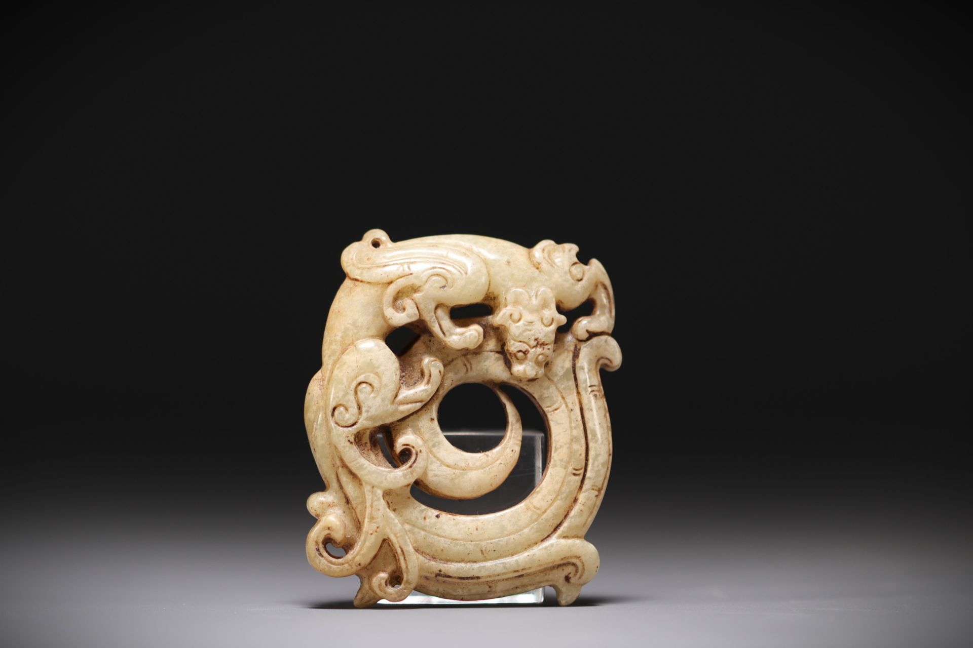 China - White jade pendant representing a phoenix.