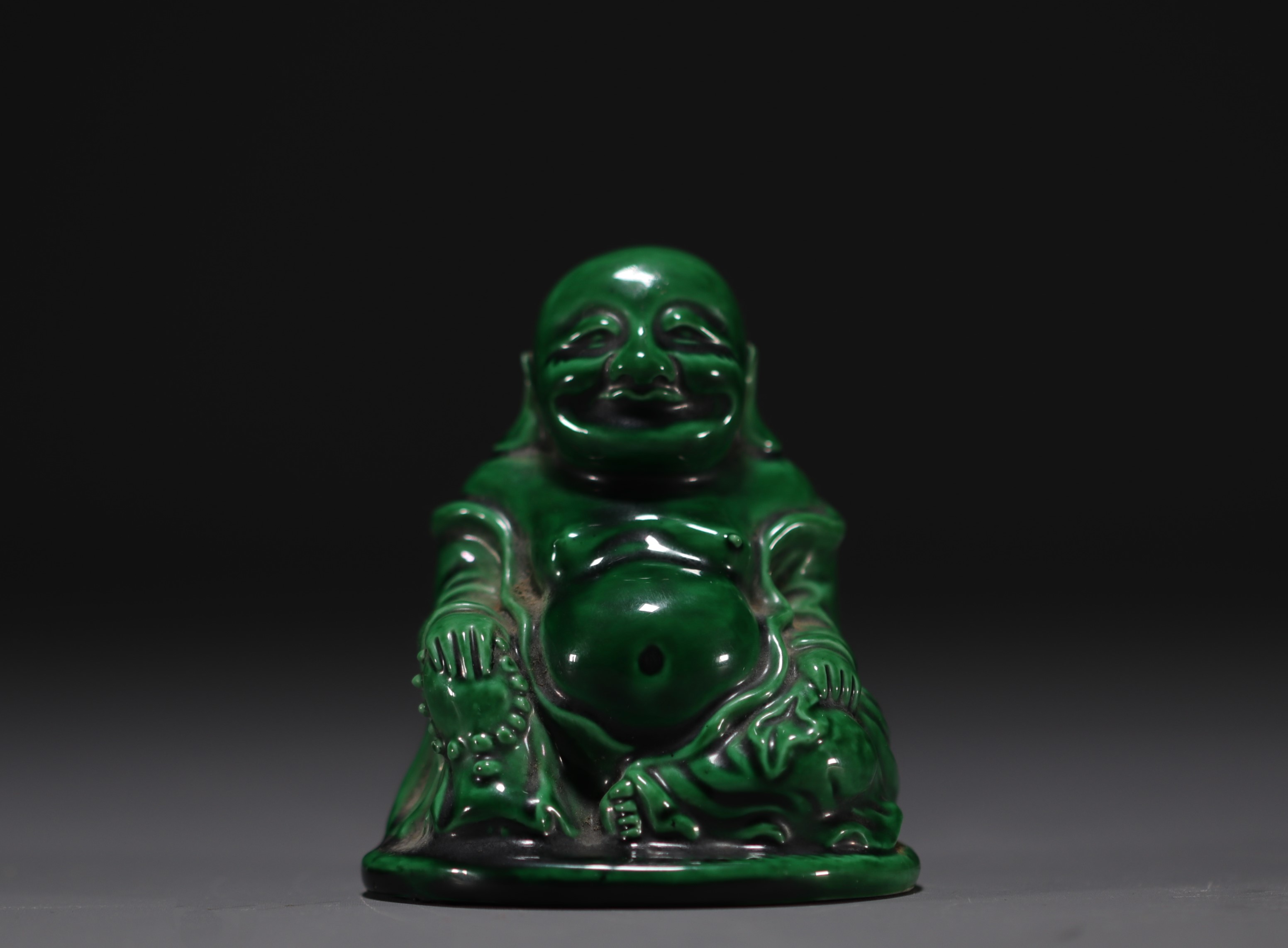 China - Buddha in green monochrome porcelain.