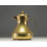 Persian coffee pot in chased brass with animal and figure motifs.