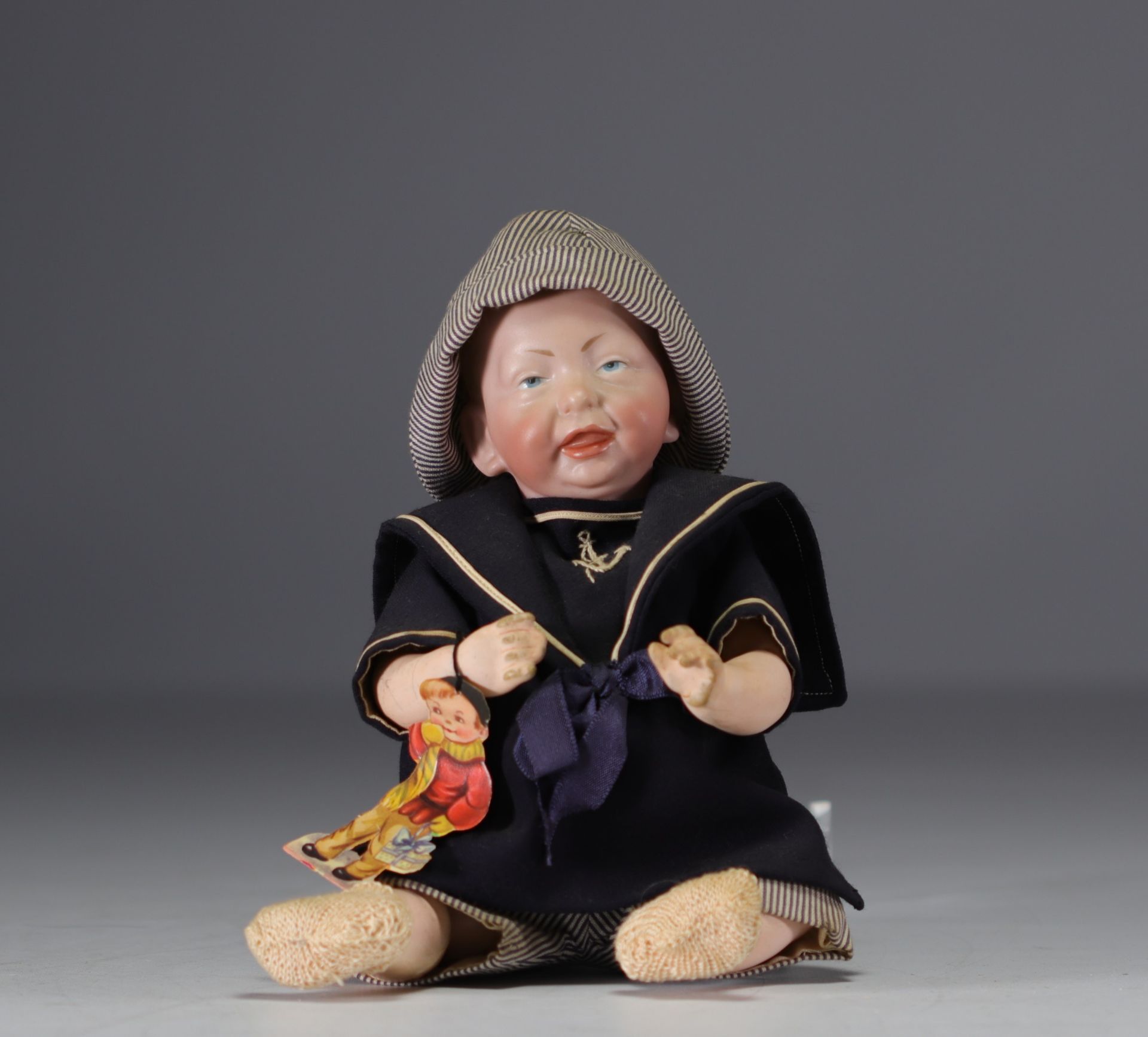 KAMMER and REINHARDT - Baby character sticking out his tongue, bisque head nÂ°28, circa 1900.