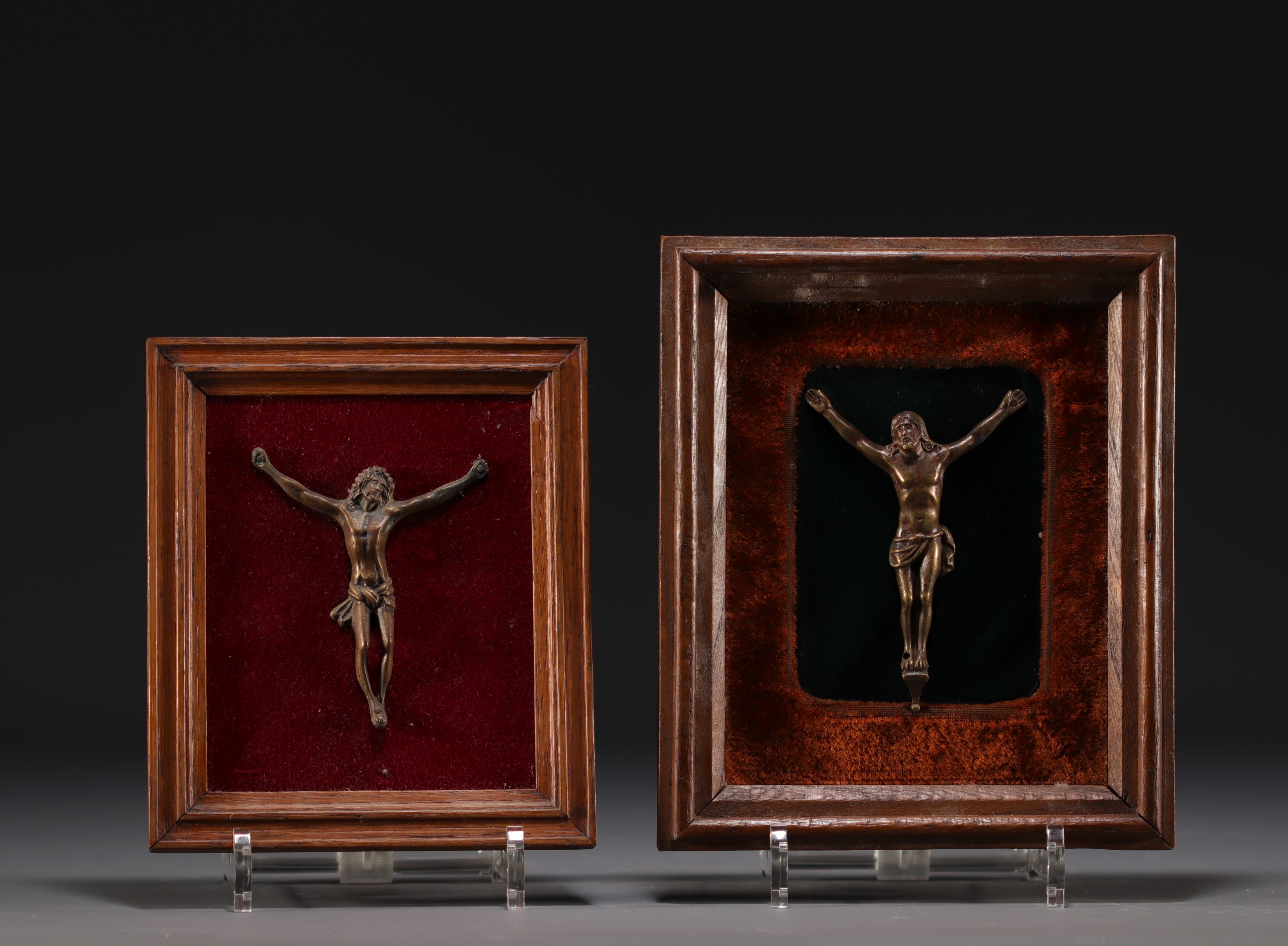 Set of two bronze Christs in their frames.