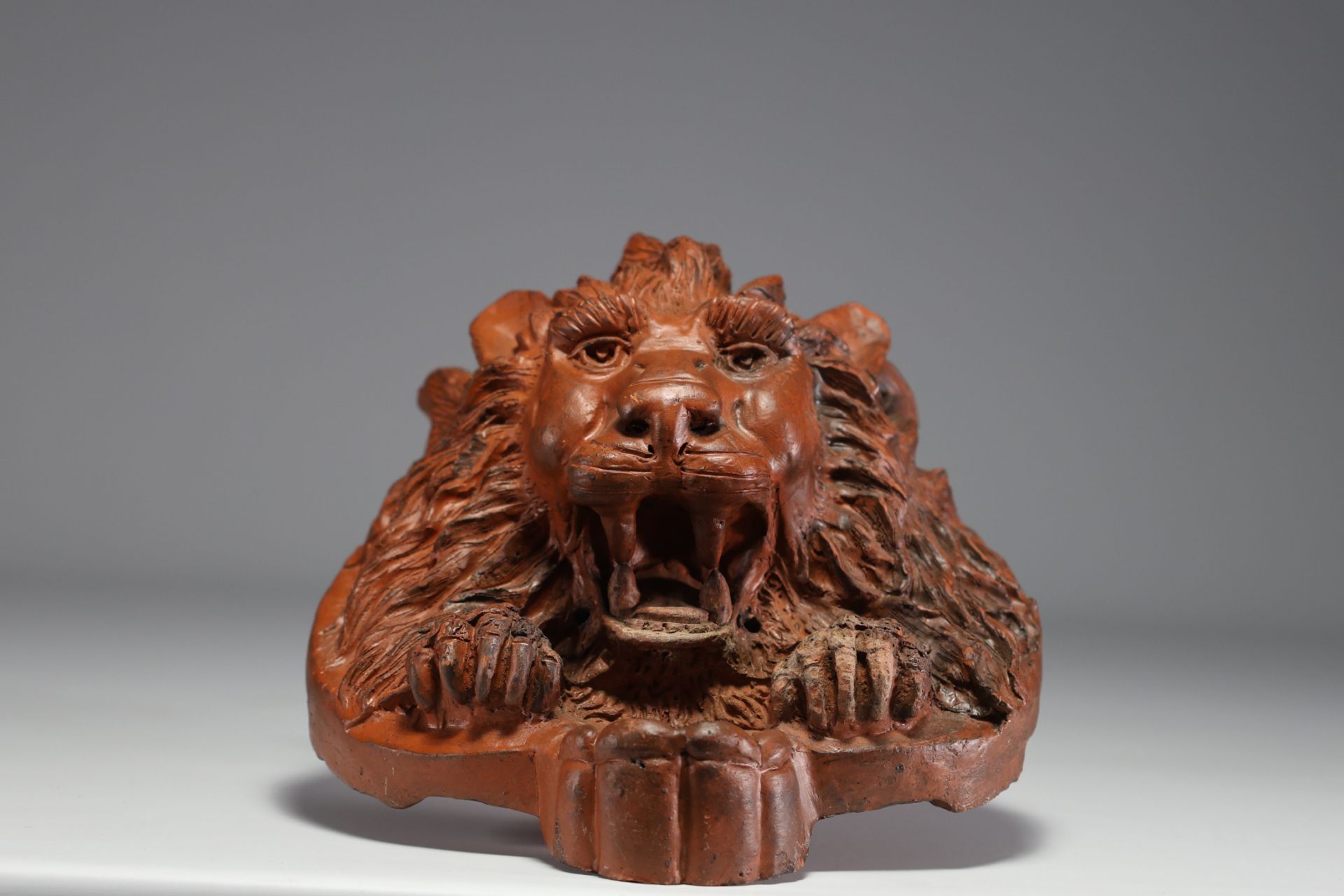 Terracotta lion's head from the front of a manor house, 19th century.