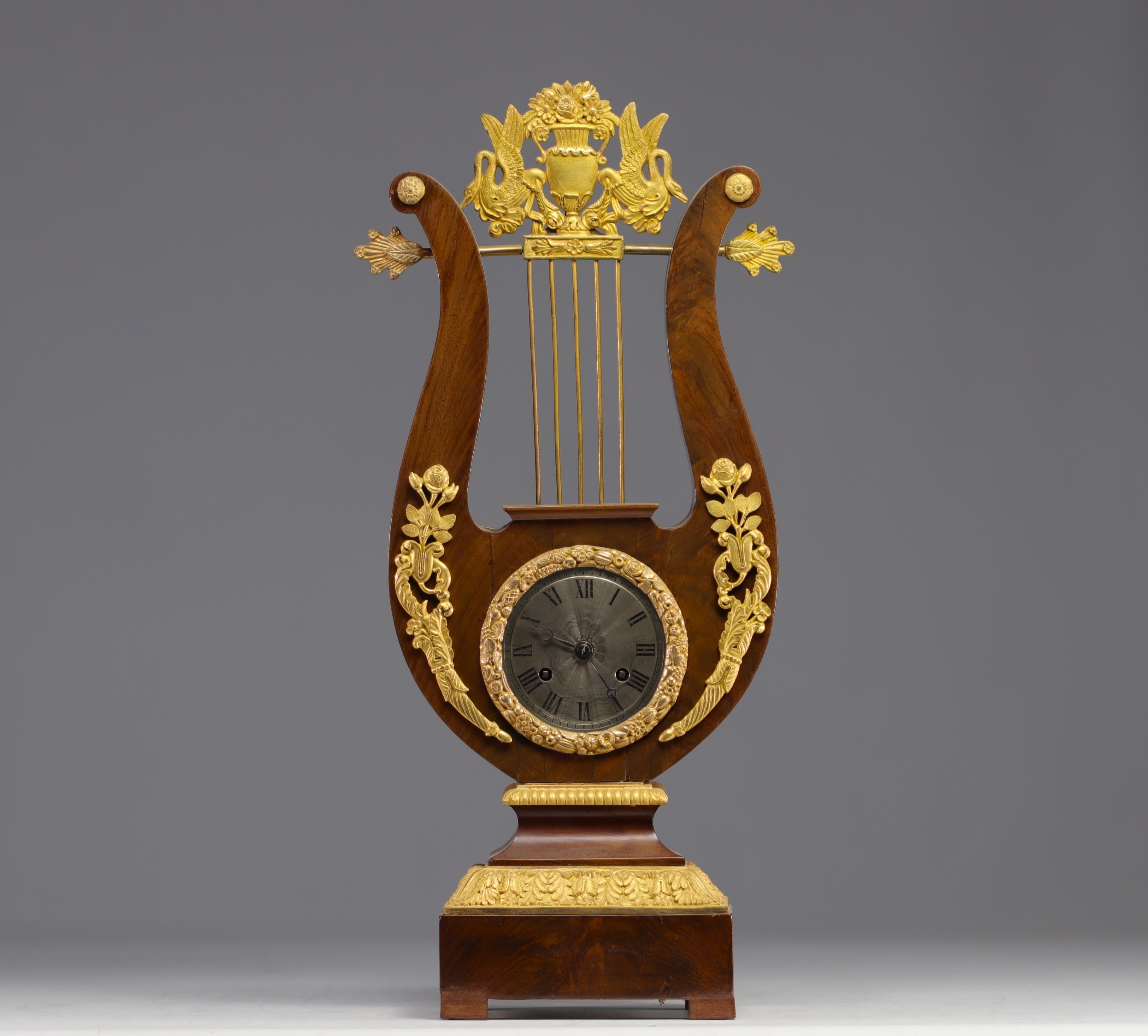 Mahogany veneered and gilt bronze "Lyre" clock, 19th century.