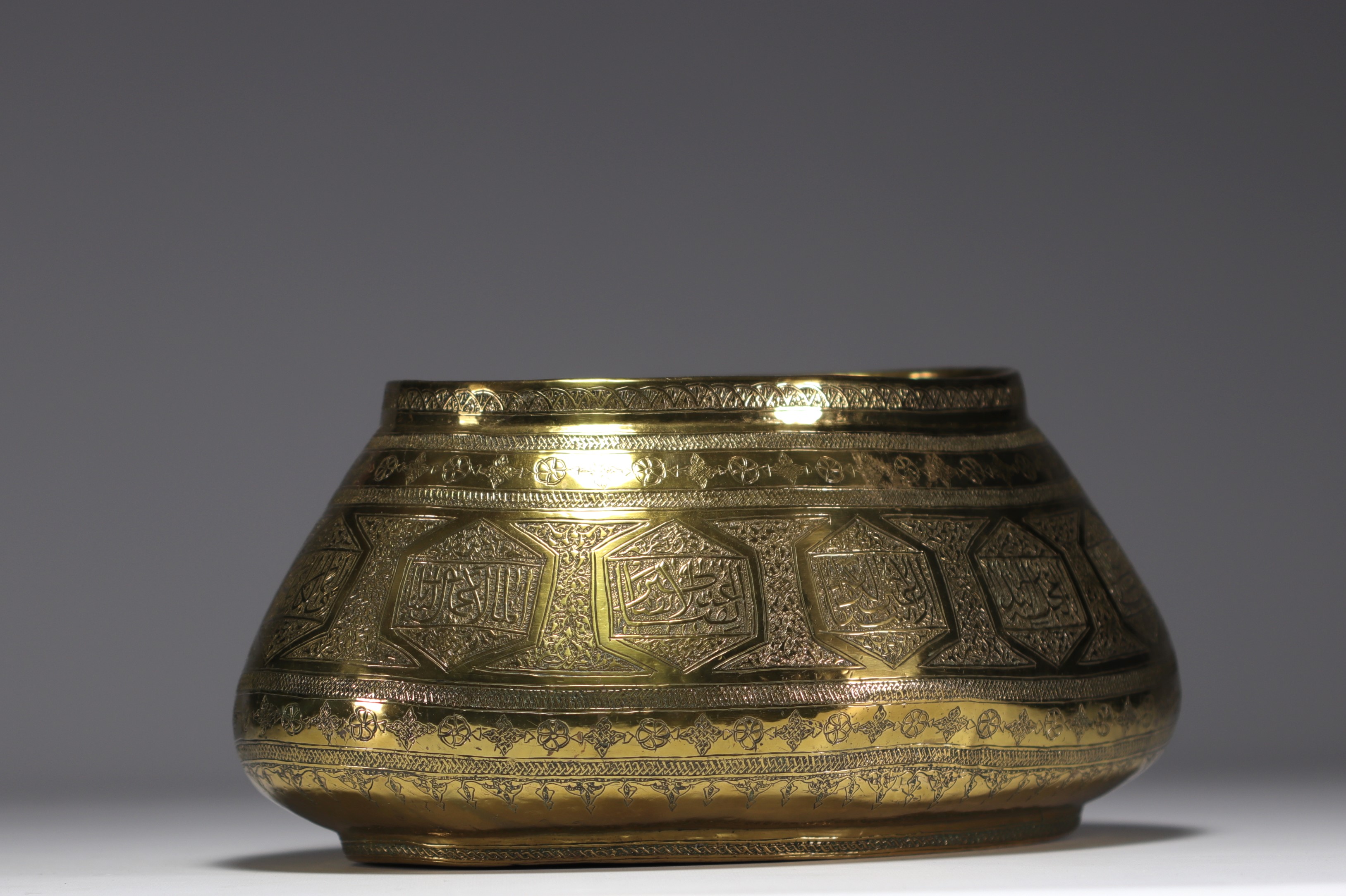 Iran - An old chased brass "Tas" basin decorated with flowers and wishes, 19th century.