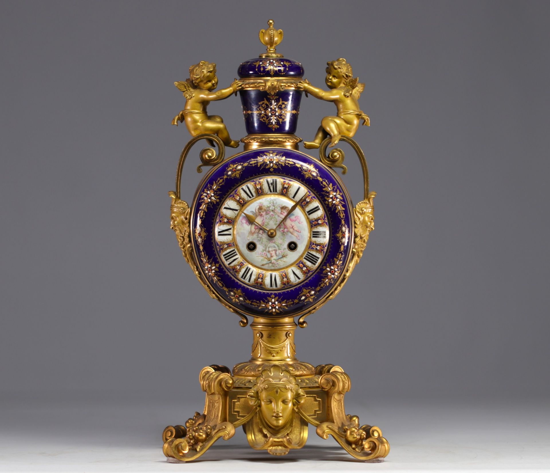 A rare Sevres porcelain and gilt bronze clock decorated with cherubs.