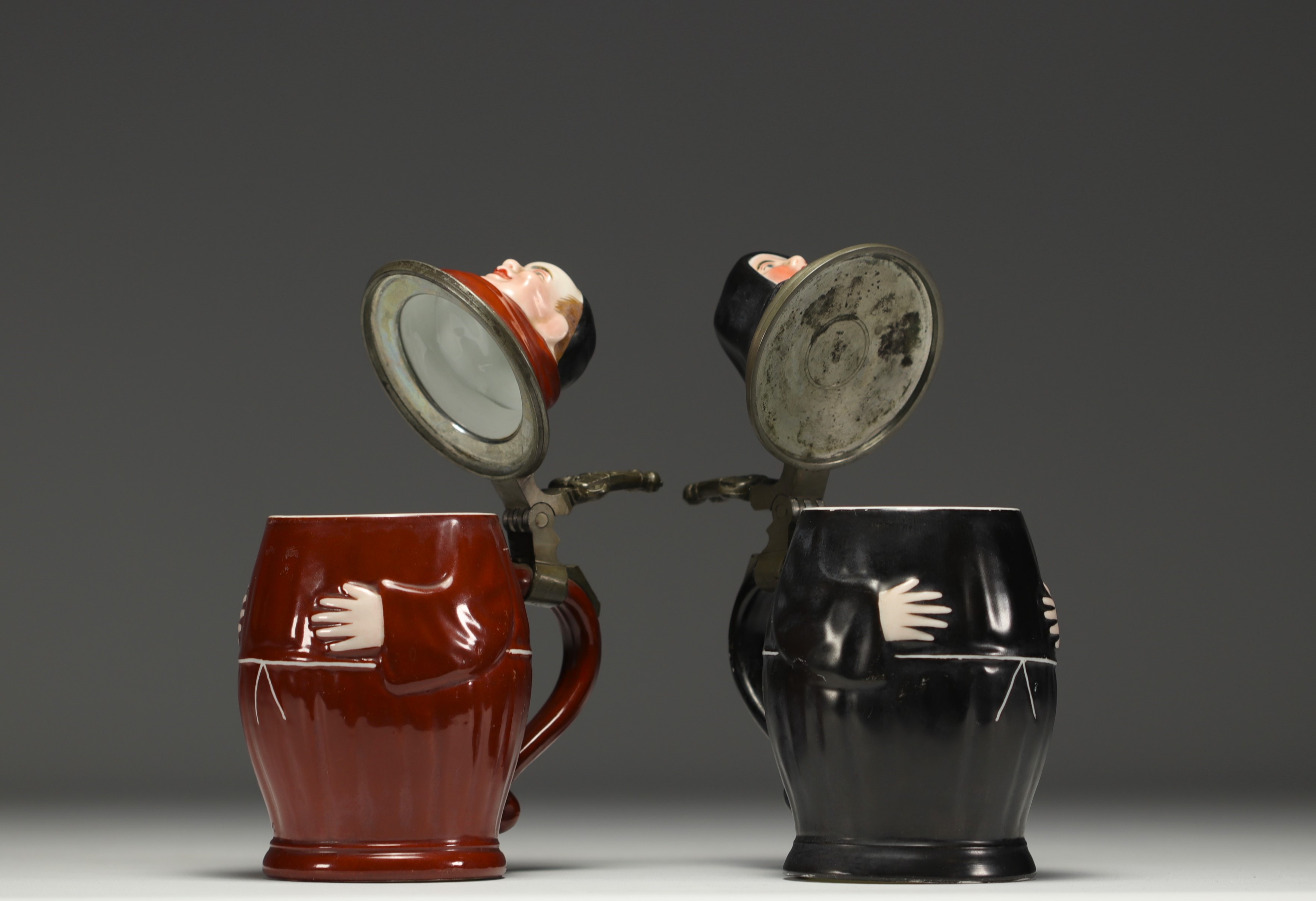 A pair of figurative porcelain mugs with lithophanied bases, by Eduard Kick in Amberg, 19th century. - Image 3 of 4